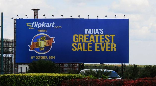 Product Billboard displaying a large outdoor sale advertisement along a roadside in India