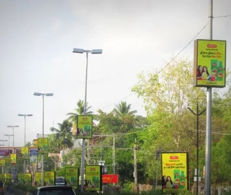 Pole kiosk advertising in Mumbai by ACME Advertising Co., showcasing vibrant street-level branding on high-traffic roads.