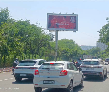 Large outdoor hoardings displayed on busy streets in Delhi, showcasing creative brand advertisements installed by top hoarding advertising companies.