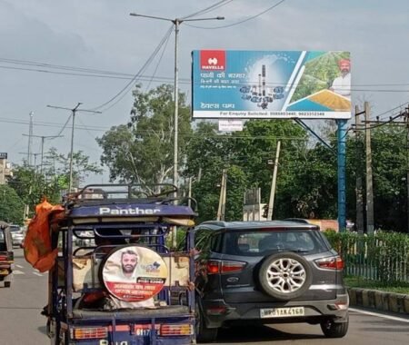 ACME Advertising Co.'s premium unipole display in a high-traffic urban location