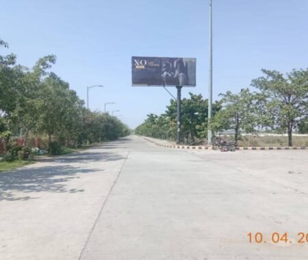 High-visibility unipole billboard installed on a busy urban highway