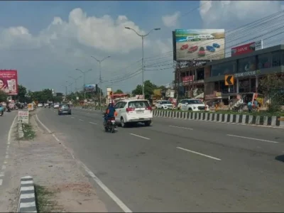 ACME Advertising Co. billboard in Lucknow near BABA CLINIC, showcasing vibrant product ads by top highway hoarding companies in Lucknow.