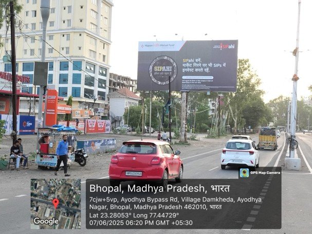 ACME Advertising Co.'s SIPahi branding execution by highway hoarding advertising company in Bhopal in Bhopal’s Ayodhya Bypass zone with urban traffic and stalls.