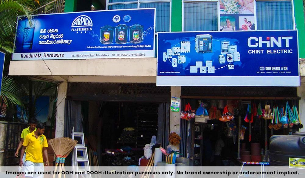 Dealer Board Advertisement showcasing hardware and electrical brands on dual shop frontage