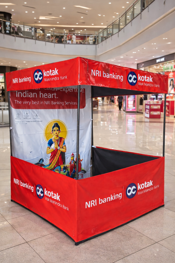 Canopy advertising booth by Kotak Mahindra Bank promoting NRI banking inside mall