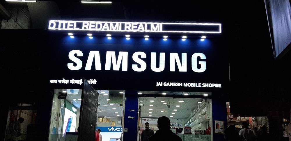 Glow Sign Board Advertising with a large illuminated Samsung showroom sign driving strong storefront recognition