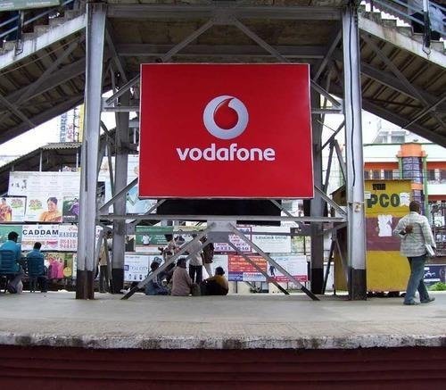 Large railway platform advertising board installed at an Indian railway station, delivering strong brand visibility to waiting passengers and daily commuters