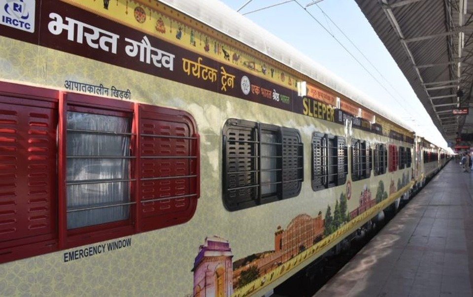 Full train exterior railway branding on an Indian passenger coach, showcasing high-visibility advertising across long-distance railway routes