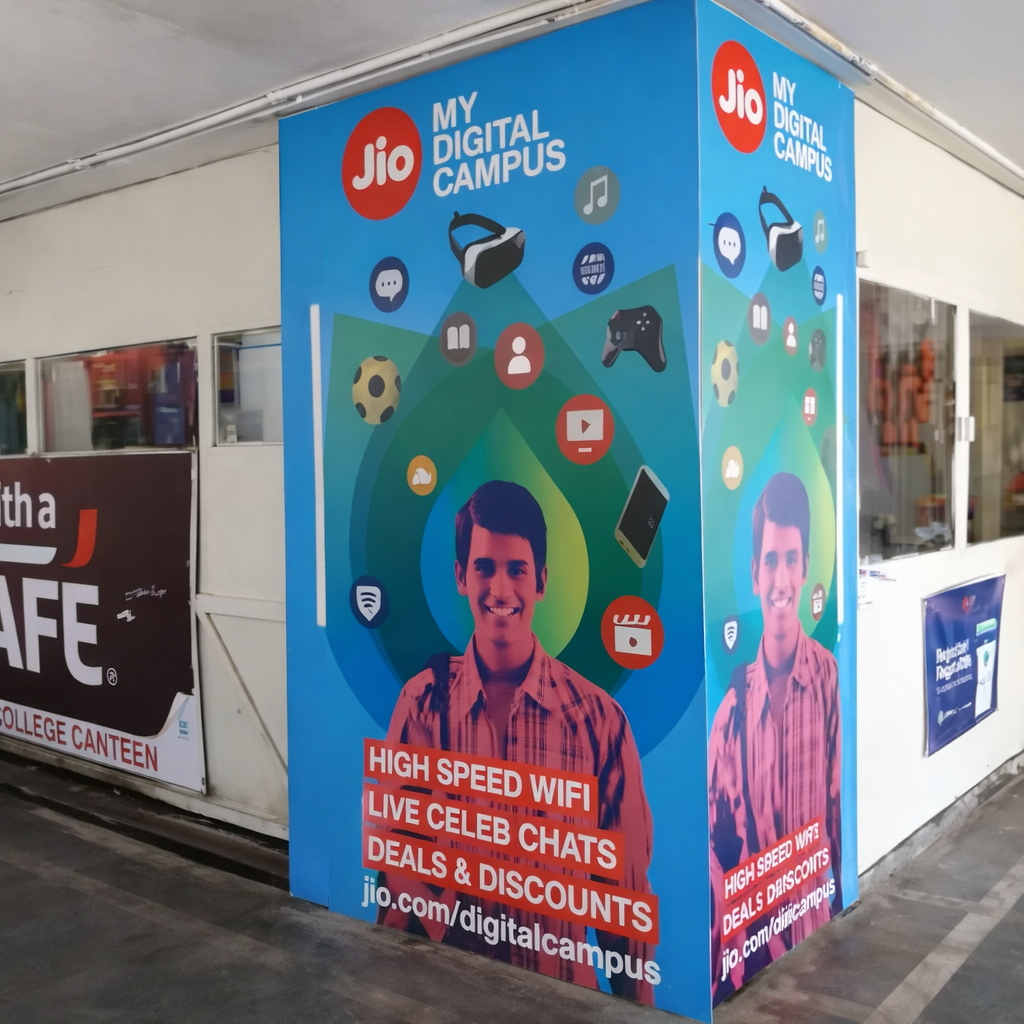 Indoor pillar wrap branding displaying digital service promotion graphics in a commercial space