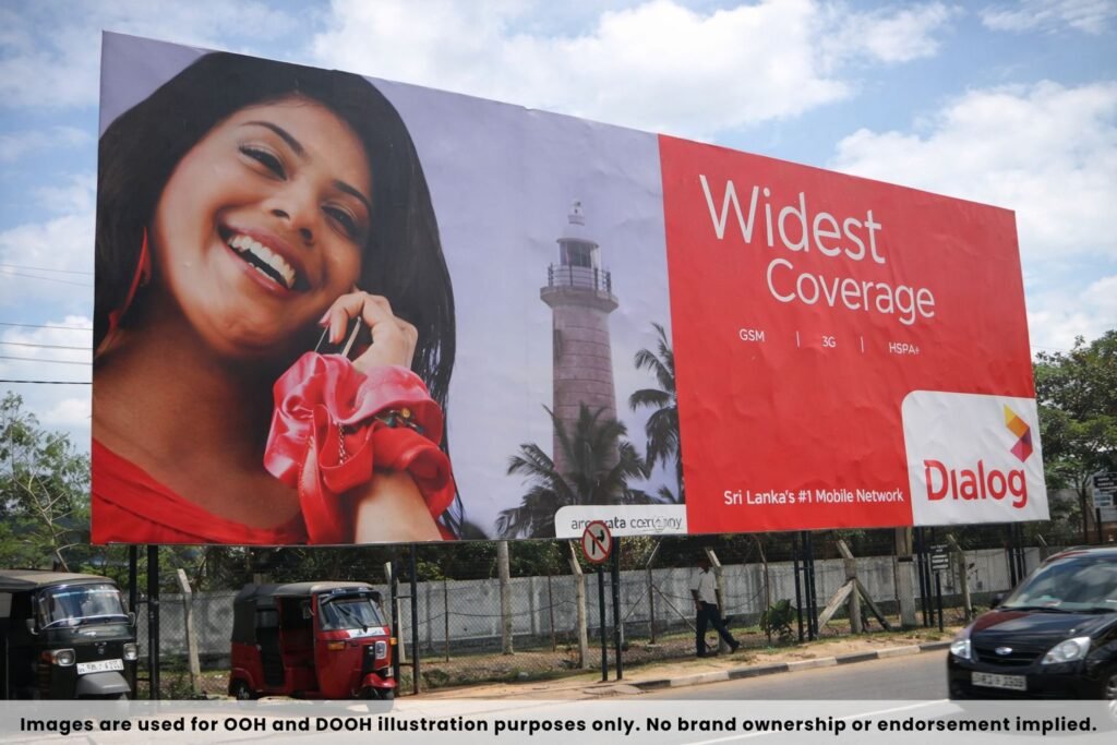 Hoarding Advertising in Kochi showcasing telecom brand campaign on a busy roadside location